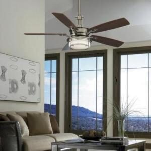 Ceiling fan installed in room with tall space