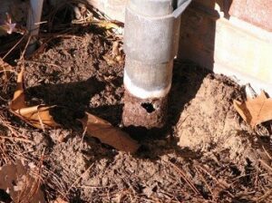 Rusted out power conduit for pool wiring needs repair